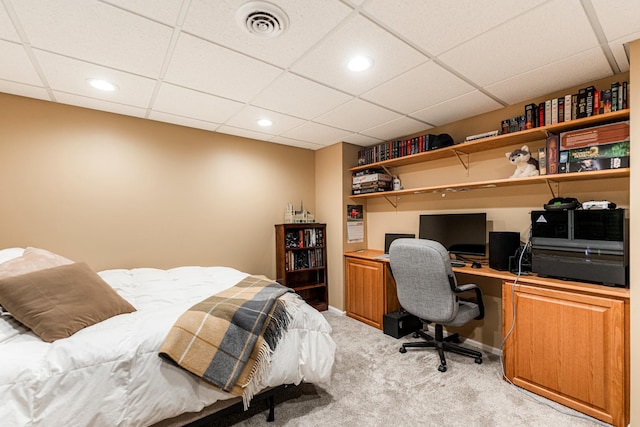 bedroom with carpet and a paneled ceiling