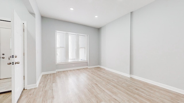 spare room with light wood-type flooring