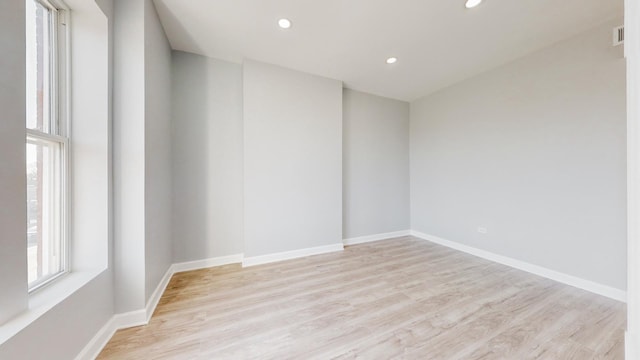 unfurnished room featuring light hardwood / wood-style floors