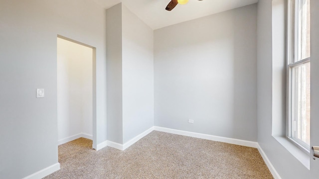 empty room with light carpet and ceiling fan