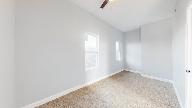 carpeted empty room featuring ceiling fan