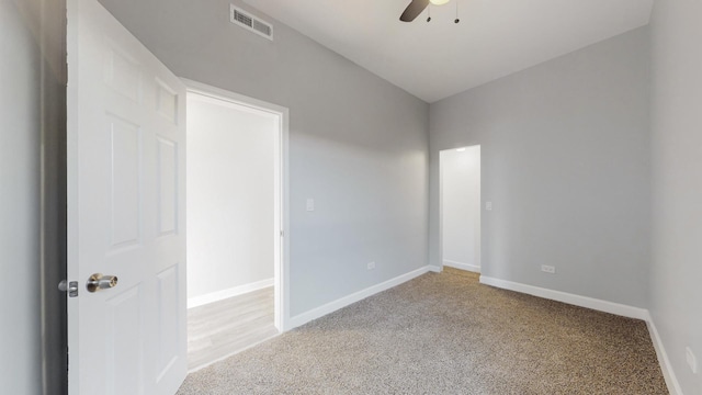 empty room with light carpet and ceiling fan