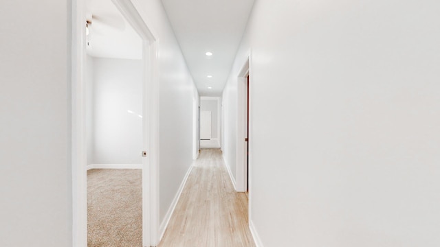 corridor featuring light hardwood / wood-style floors