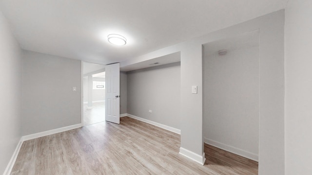 basement with light hardwood / wood-style floors