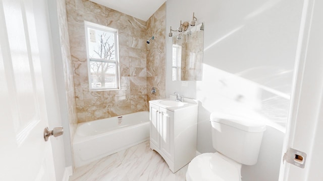 full bathroom with toilet, vanity, and tiled shower / bath combo