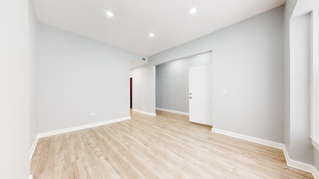 unfurnished room with light hardwood / wood-style floors