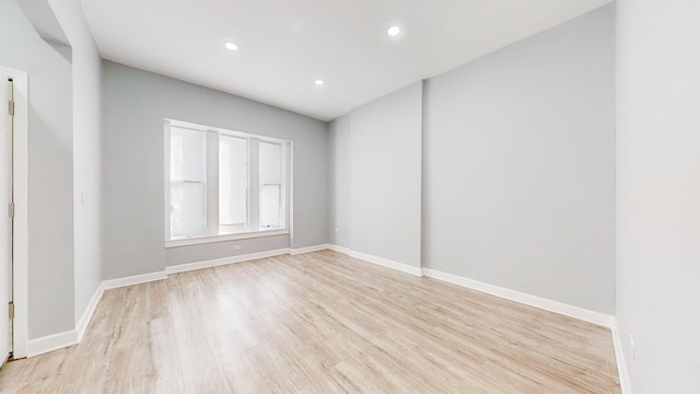 unfurnished room with light hardwood / wood-style flooring