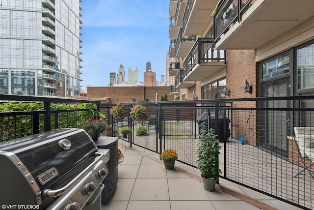 balcony with a grill and a view of city