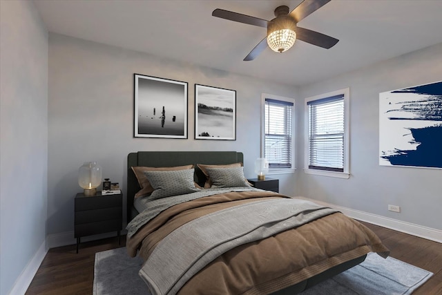 bedroom featuring ceiling fan and dark hardwood / wood-style floors