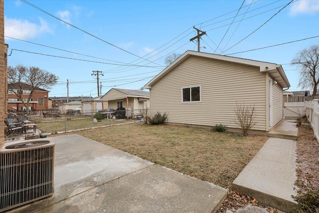 exterior space featuring a patio, central air condition unit, and a yard