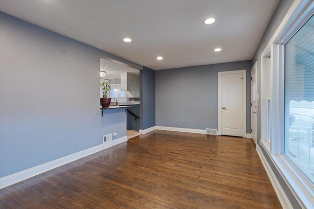 empty room featuring dark wood-type flooring