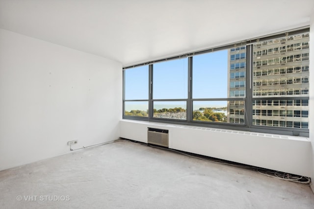 spare room with a wall unit AC