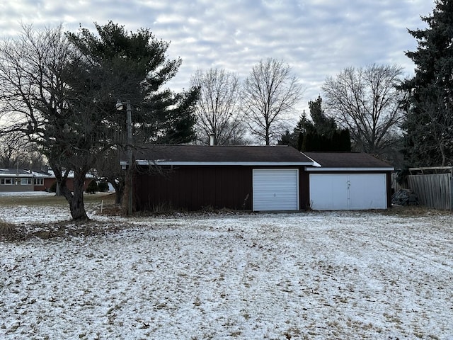 view of snow covered garage