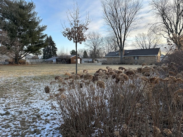 view of yard layered in snow