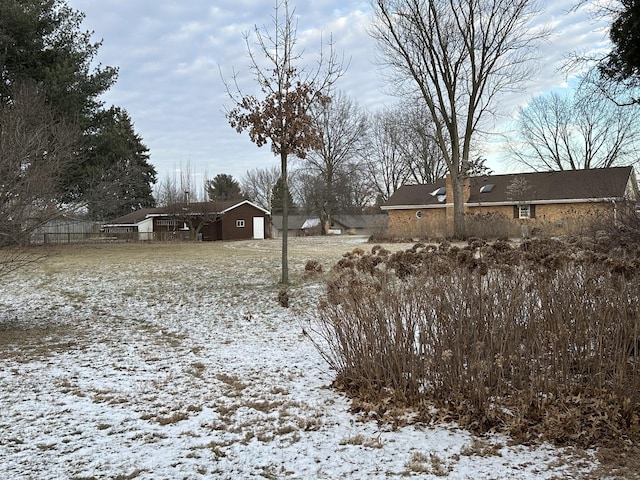 view of yard covered in snow