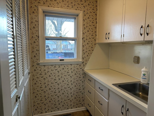 kitchen with sink and tile patterned flooring