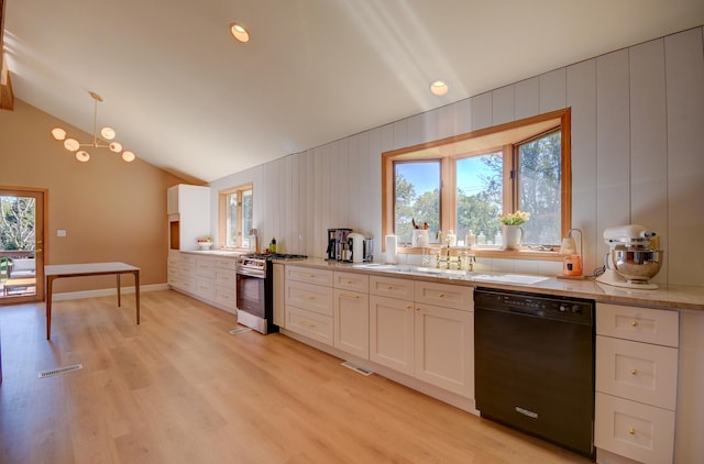 kitchen featuring white cabinets, plenty of natural light, dishwasher, and stainless steel gas range