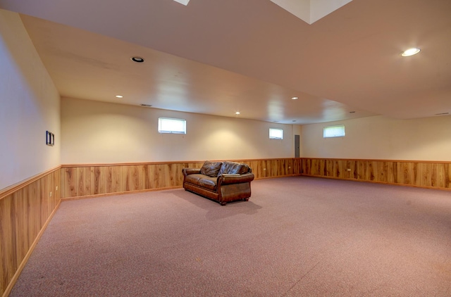 unfurnished room with a healthy amount of sunlight and carpet floors