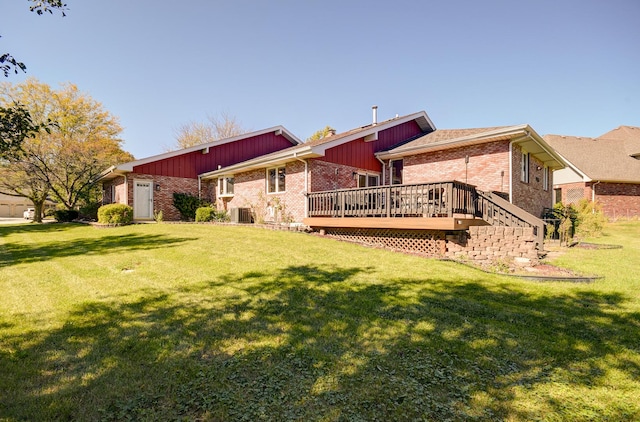 rear view of property featuring a wooden deck, a yard, and central AC unit