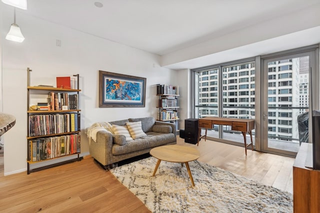 sitting room featuring hardwood / wood-style flooring and a wealth of natural light