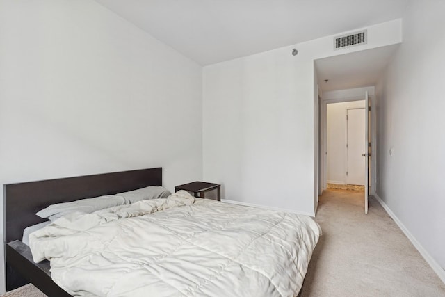 bedroom with light carpet