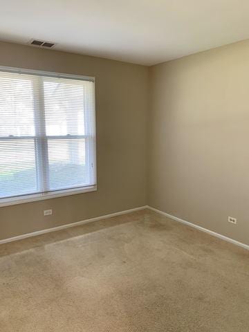 unfurnished room featuring carpet floors