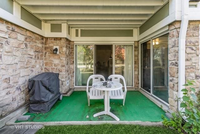 view of patio featuring a grill