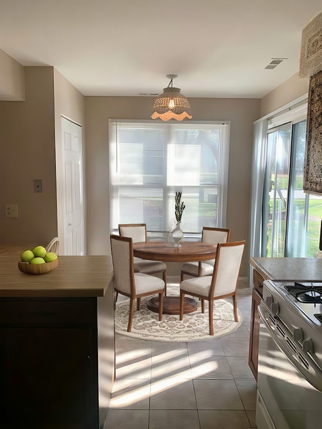 dining space with light tile patterned floors