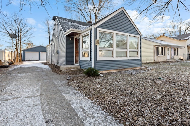 view of side of home with a garage and an outdoor structure