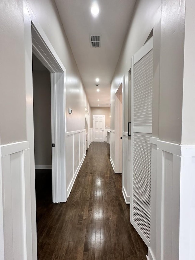 hall with dark hardwood / wood-style flooring