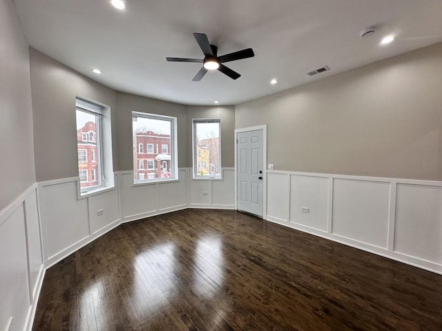 spare room with ceiling fan and dark hardwood / wood-style floors