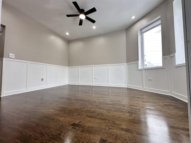 spare room featuring ceiling fan and dark wood-type flooring