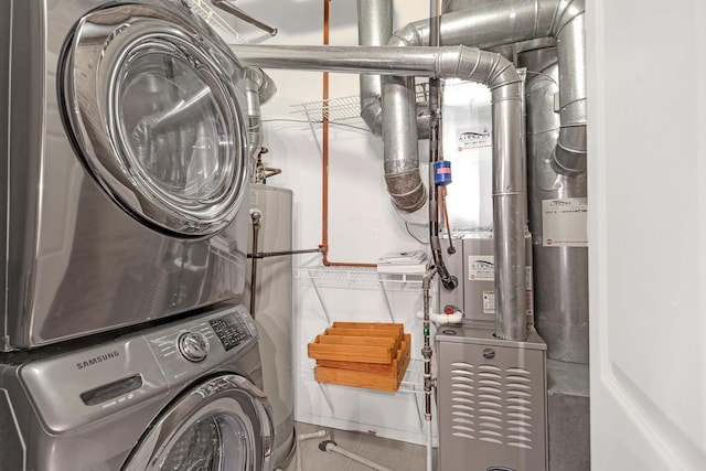 washroom with stacked washer and dryer, heating unit, and tile patterned flooring