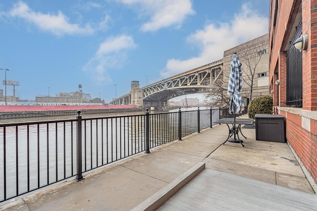 view of patio featuring a water view