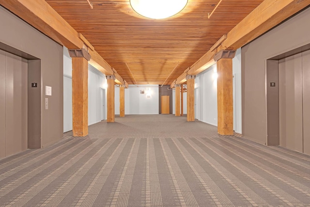 corridor with wood ceiling, elevator, and carpet