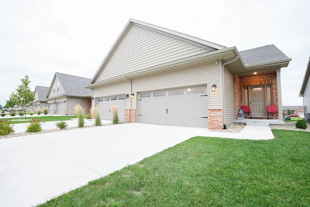 view of front facade with a front yard and a garage