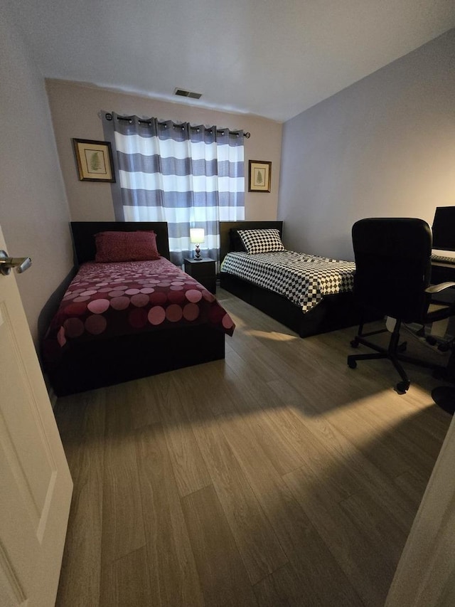 bedroom featuring hardwood / wood-style floors