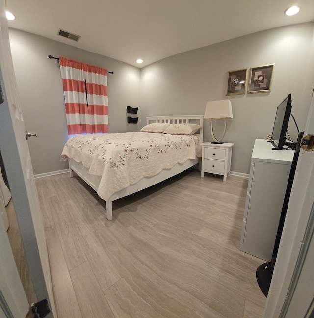 bedroom with light hardwood / wood-style flooring