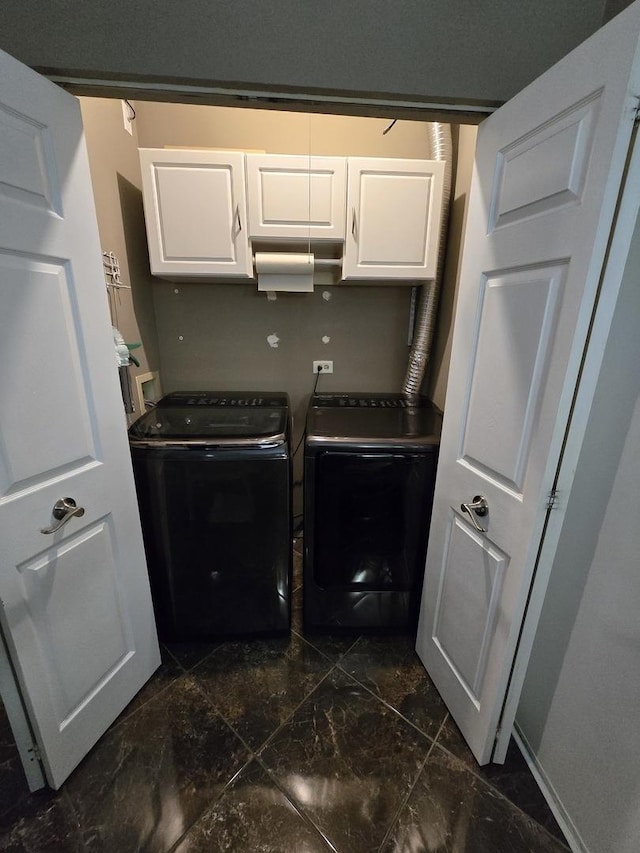 washroom with cabinets and separate washer and dryer