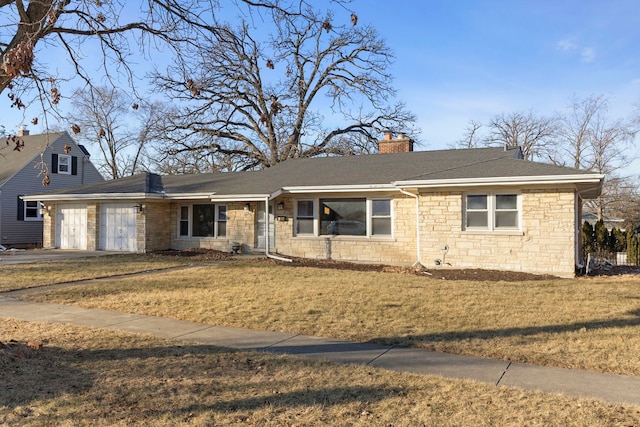 ranch-style house with a garage and a front lawn