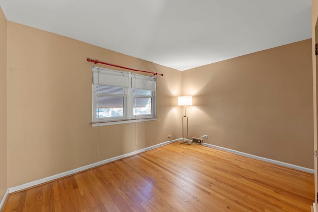 spare room featuring hardwood / wood-style floors