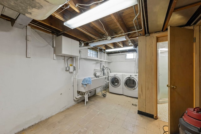 washroom with cabinets and independent washer and dryer