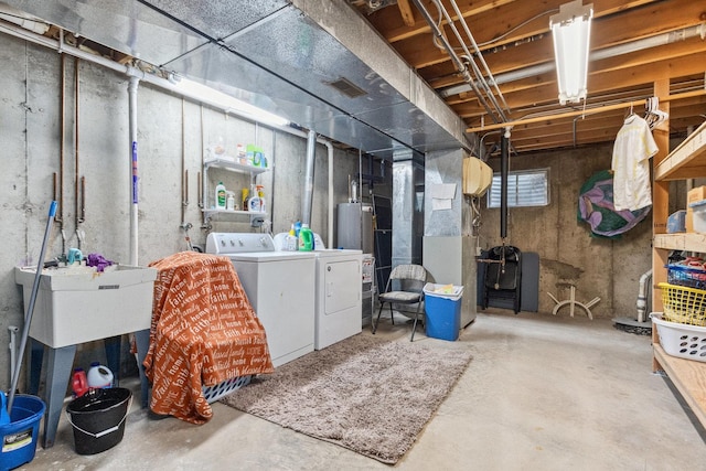 basement featuring washer and dryer and gas water heater