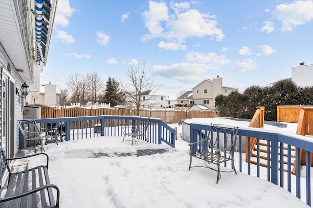 snow covered deck with a covered pool