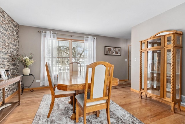 dining space featuring light wood-type flooring