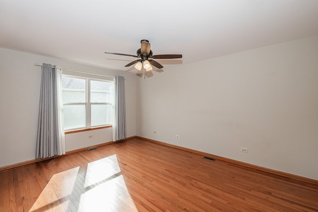 spare room featuring ceiling fan and light wood-type flooring