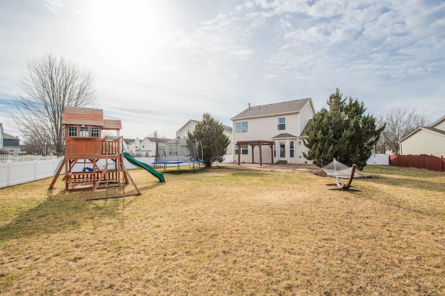 view of yard featuring a pergola, a playground, and a trampoline