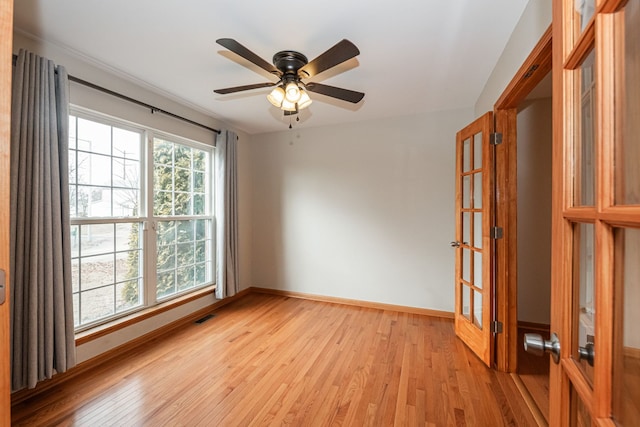 unfurnished room with ceiling fan and light hardwood / wood-style floors