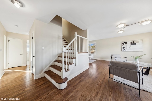 stairway with hardwood / wood-style floors