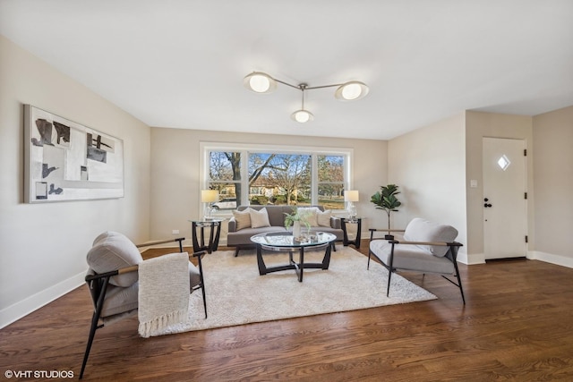 living room with dark hardwood / wood-style flooring